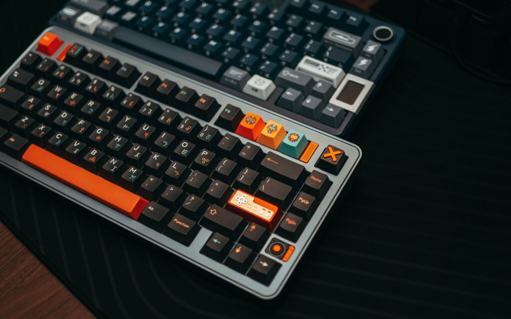 Best Mechanical Keyboards for Productivity Close-up of colorful mechanical keyboards on a desk, showcasing unique keycaps and modern design.