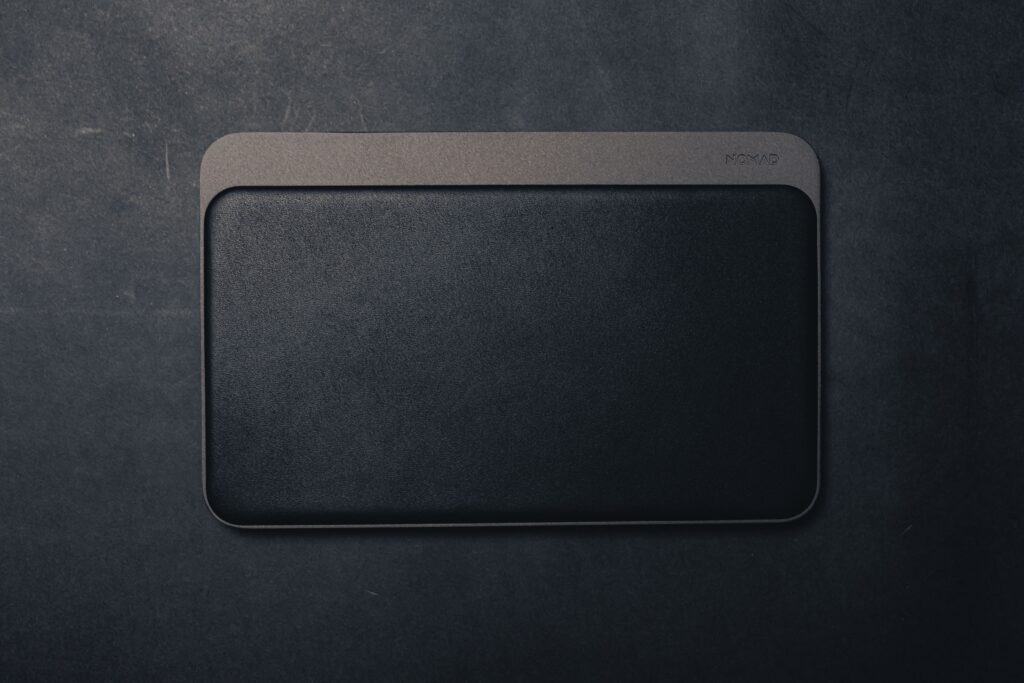 Sleek and stylish black leather textured mouse pad offering a minimalist design with ample copy space.